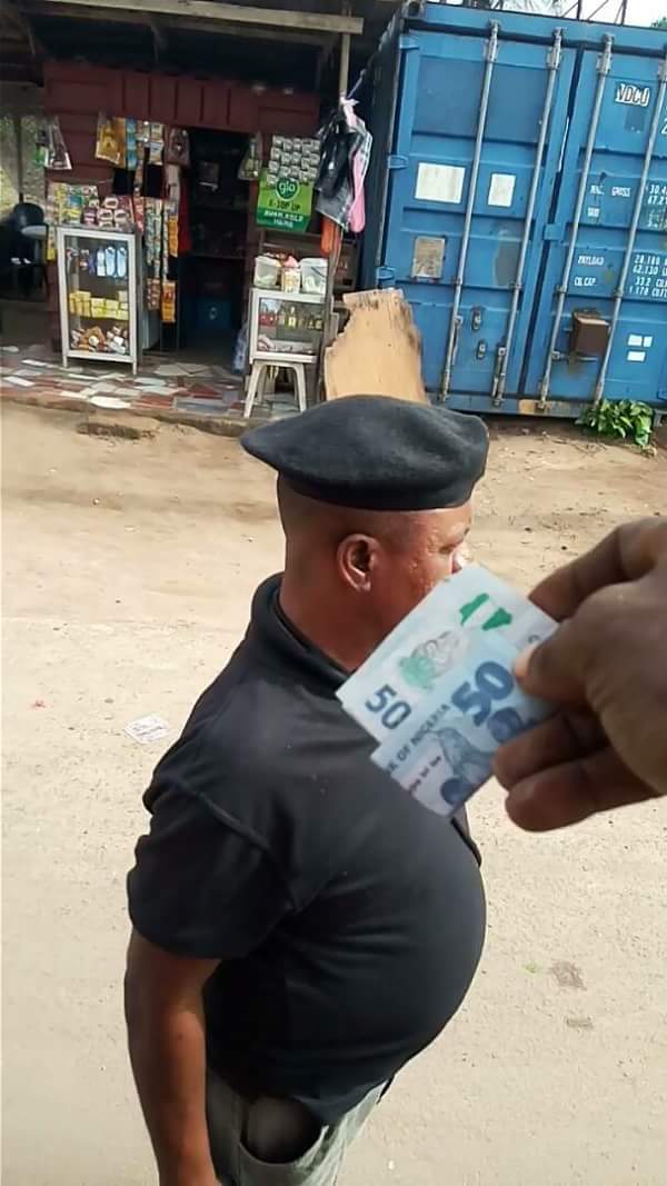 Police Officer Supo Syril Was Allegedly Caught On Camera Extorting Money From Motorists In Abia