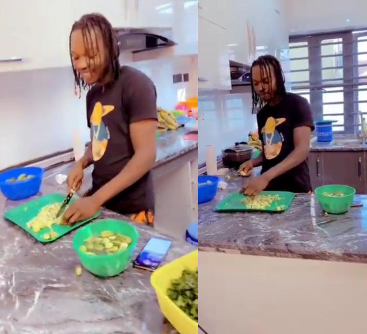 “Women And Men Belong In The Kitchen” – Naira Marley Says While Showing Off Cooking Skills (Video)